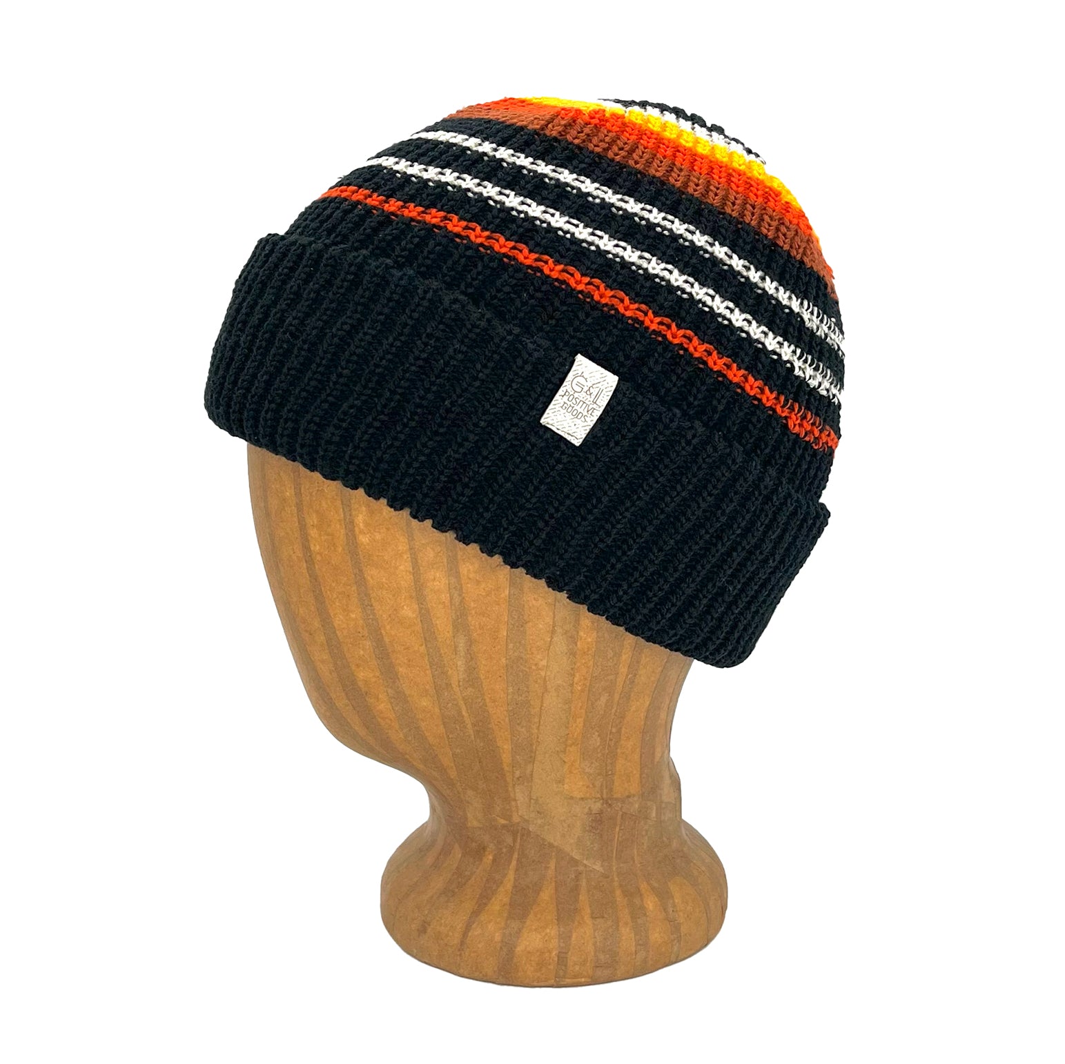 Black beanie with colorful stripes on a wooden mannequin head against a white background
g-and-l-positive-goods-blaze-beanie-left-side