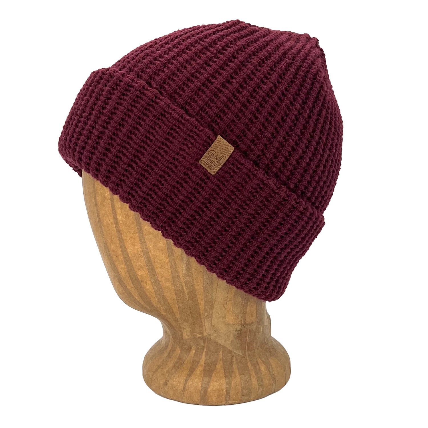 Maroon knit beanie on a wooden mannequin head with a visible brand logo against a white background
g-and-l-positive-goods-kayo-beanie-left-side