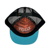 La Playa Riviera Trucker Hat underside view showcasing adjustable snapback and a hidden message "YOLO: You only live once".