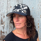 Meadow Trucker Hat – three-quarter view of Bohemian trucker hat on female model.