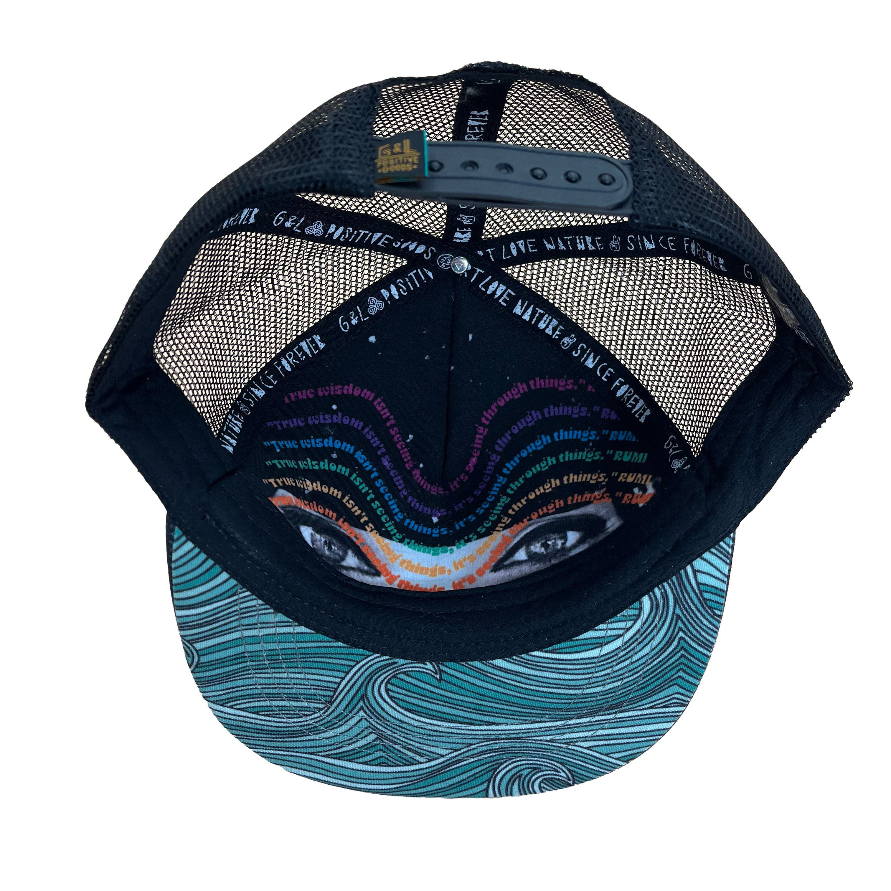 Underside view of the Waves Trucker Hat, showing its durable construction, soft interior, and flat brim.