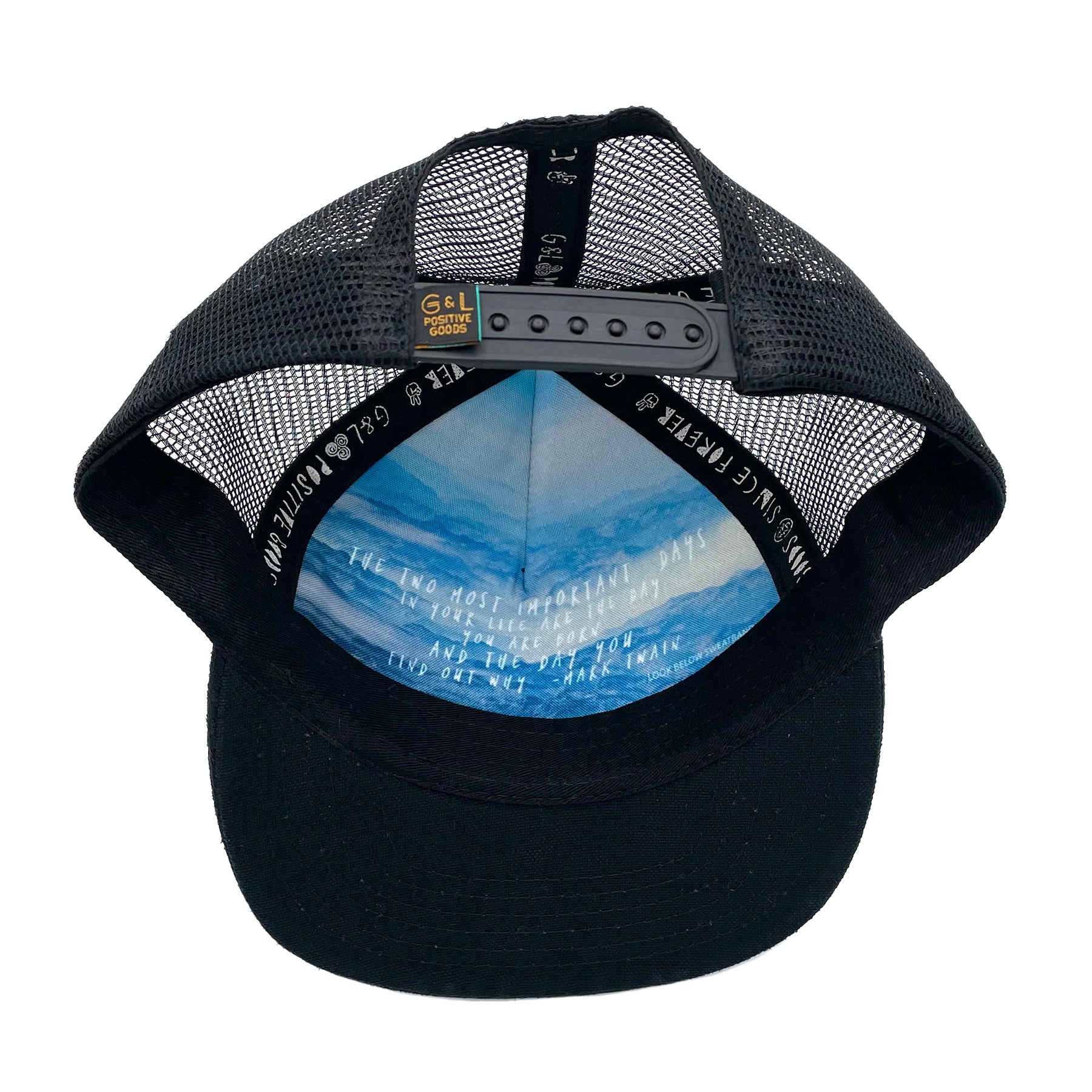 Underside view of the Zuma Azure Trucker Hat with hand-loomed cotton, faux suede visor, and adjustable mesh snapback.