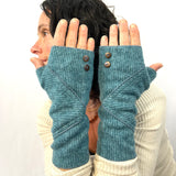 Phoenix Wrist Warmers in sapphire blue color way – front view of Female Model Wearing Recycled Gloves