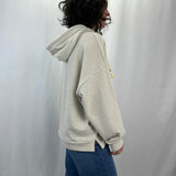 Sea Breeze Hoodie in French Linen – female model sporting side profile , dropped shoulders.