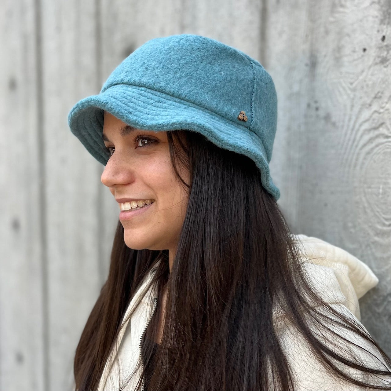 Taylor Bucket Hat in light bahama blue on female model profile view – co-gender eco-friendly soft cap