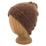 UP Beanie in Caramel color – worn on wooden head block.