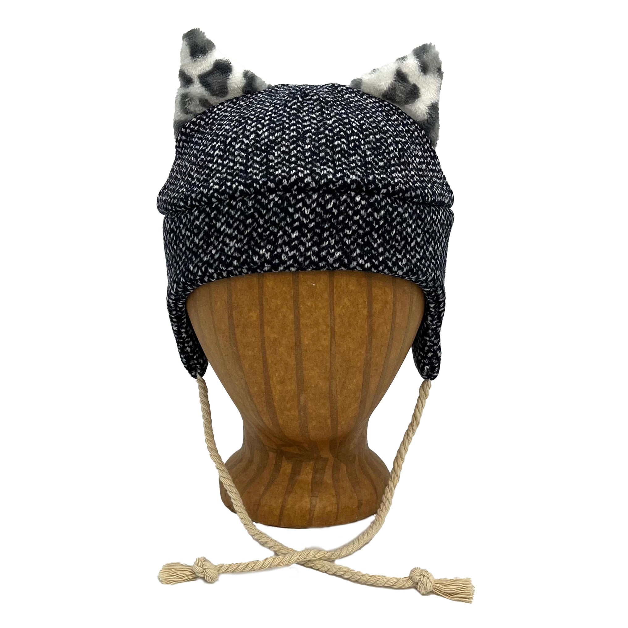 Wildkat Beanie in Blue Speck color way, front view on wooden head block – fun kids fleece hat with ears by G & L Positive Goods