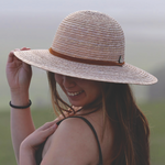 Handwoven palm straw sun hat for women. Wide brim provides sun protection. Adjustable chin strap. Shop sustainable.  *latte