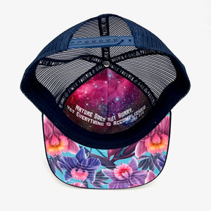 Unisex low-profile floral trucker hat. Adjustable snap with mesh back. Inspirational quote inside. *orchid