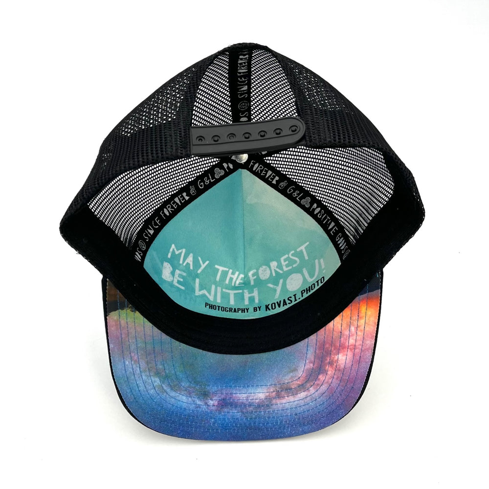 Five-panel low-profile graphic print Horizon Galaxy Trucker Hat. Adjustable snap with mesh back. Inspirational quote inside.