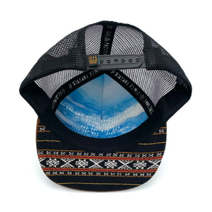Five-panel low-profile Zuma Aztec unisex trucking hat. Hand loomed Indian cotton fabric and faux suede. 