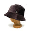 A dark brown corduroy bucket hat displayed on a wooden mannequin head against a white background.