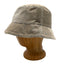 A beige bucket hat with thin navy blue stripes, displayed on a wooden mannequin head against a white background.