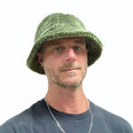 Man wearing a green knitted hat on a white background Bucket Hat Polar Fleece on male model – upcycled unisex winter hat