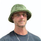Man wearing a green knitted hat on a white background Bucket Hat Polar Fleece on male model – upcycled unisex winter hat