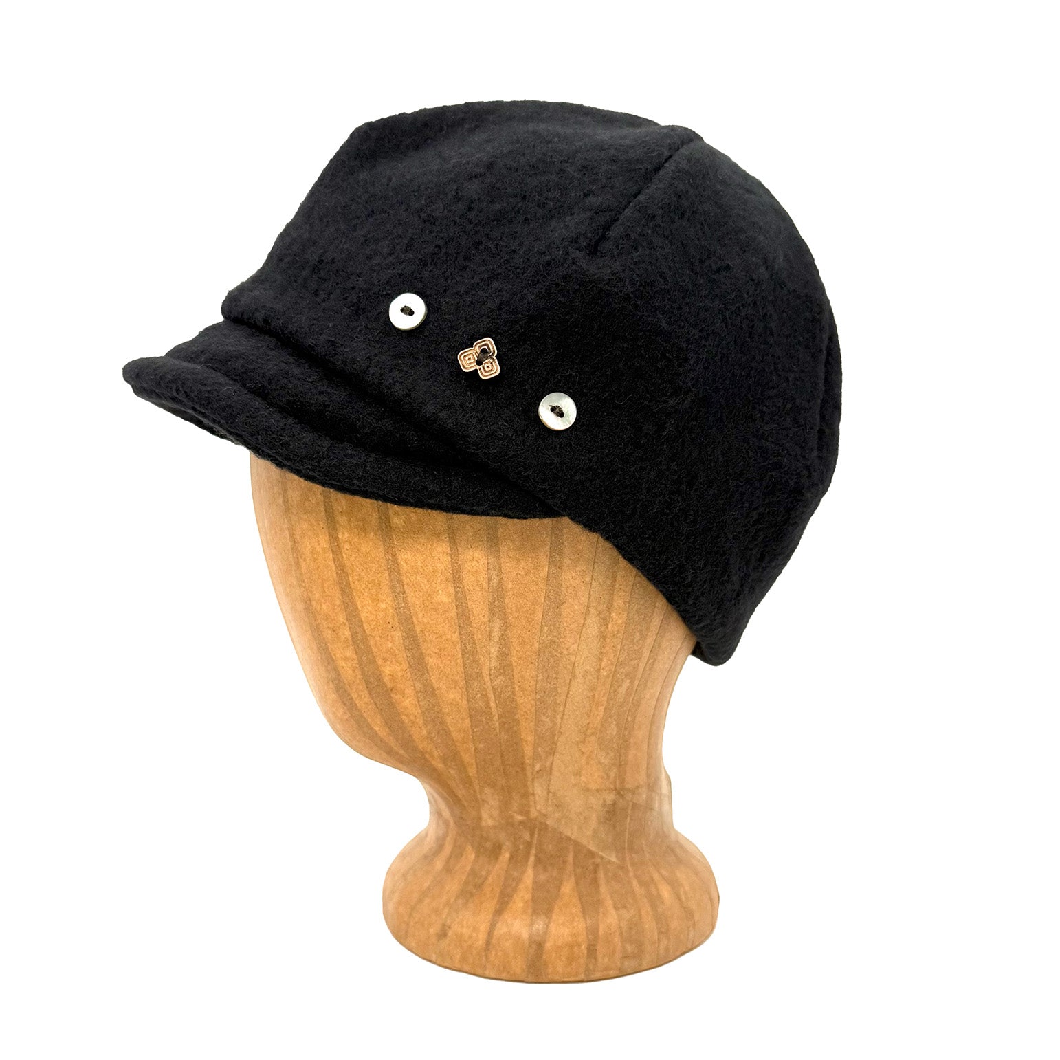 Black knit cap on a wooden mannequin head against a white background
g-and-l-positive-goods-camden-cap-left-side