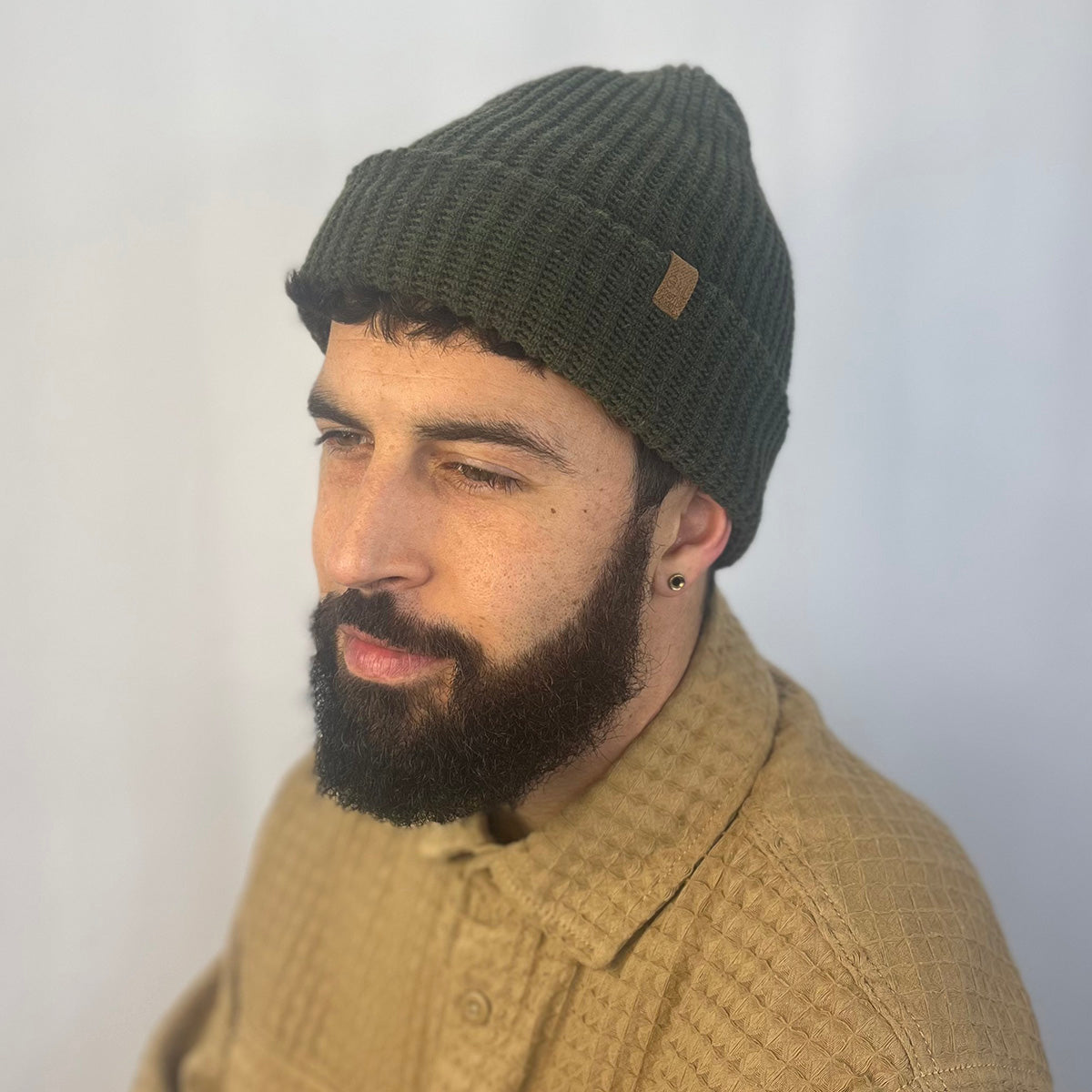 Man wearing a green knit beanie and beige sweater against a white background
g-and-l-positive-goods-kayo-beanie-male-model