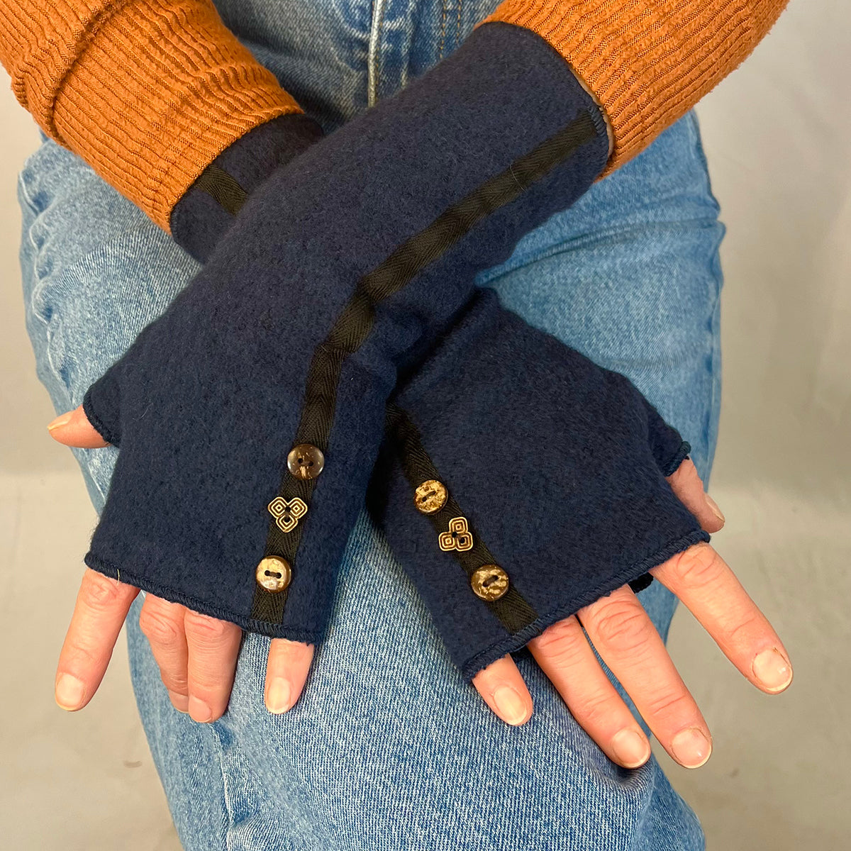 Female model wearing  navy Mary Jane wrist warmers – sustainable cotton rayon blend 