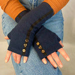 Female model wearing  navy Mary Jane wrist warmers – sustainable cotton rayon blend 