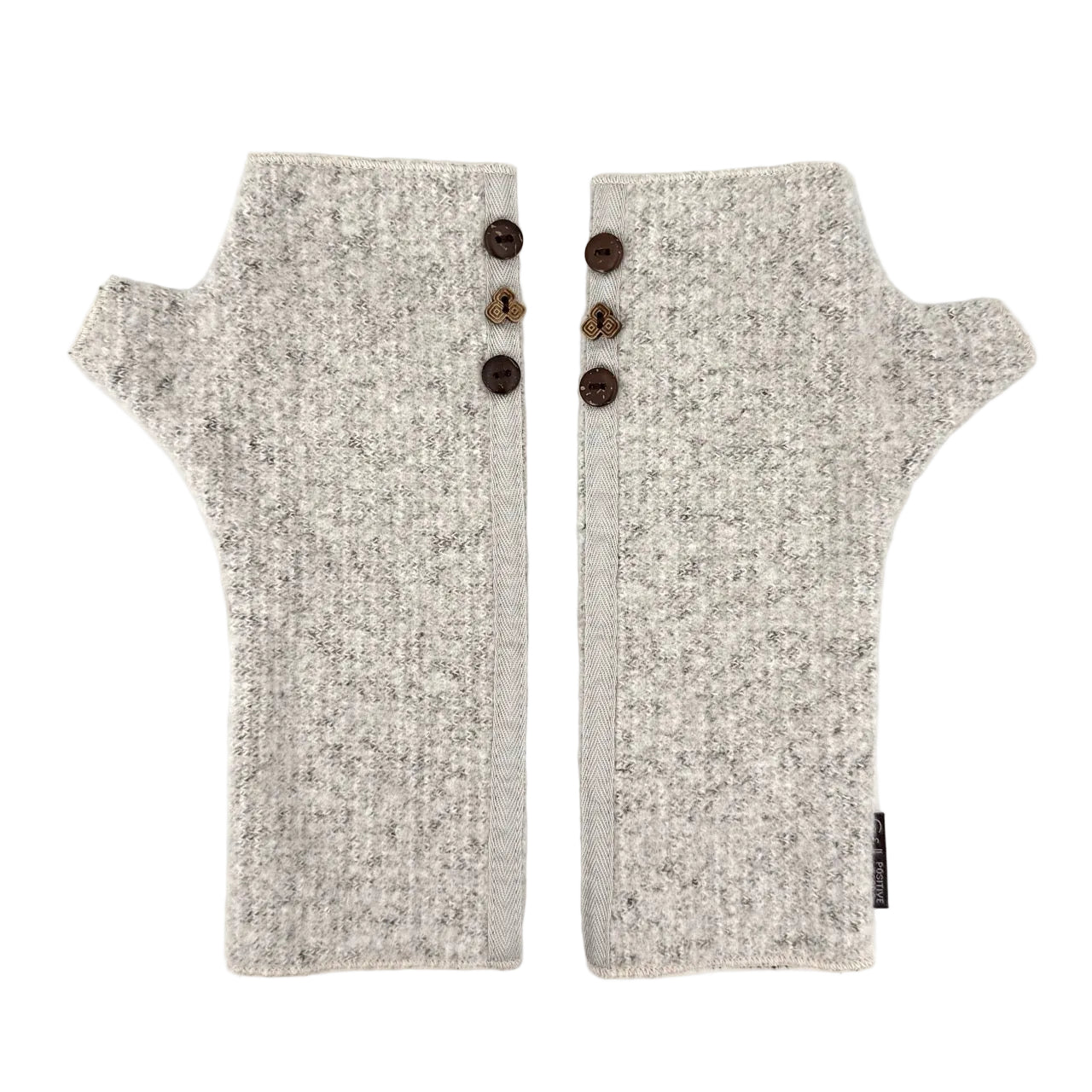 A pair of light gray and white heathered knit fingerless gloves with three dark brown buttons on the back, displayed flat against a white background.