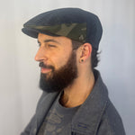 Matisse Flat Cap side view on male – upcycled black denim flat cap with camo detail
