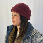 Person wearing a burgundy knit hat and denim jacket against a plain background
g-and-l-positive-goods-shorty-brimless-cap-female-model