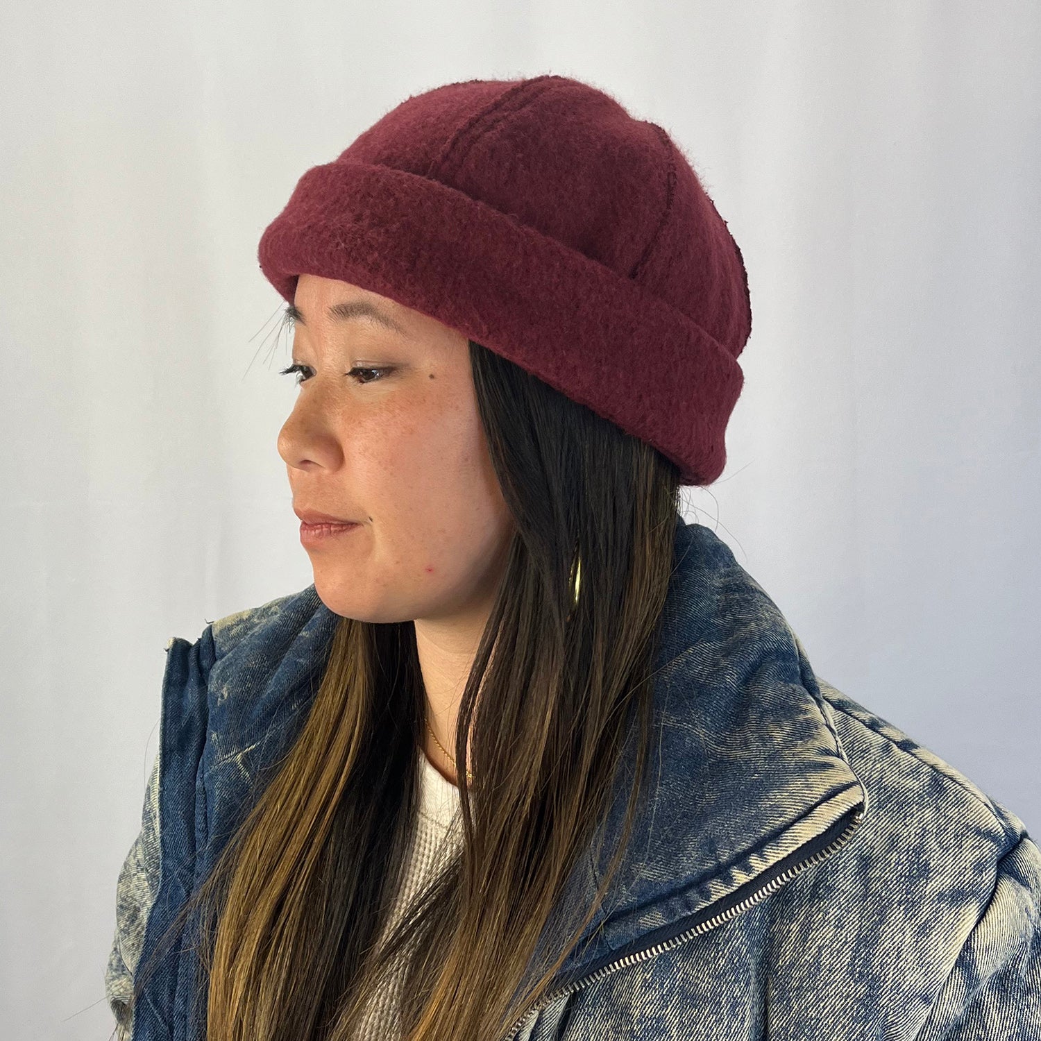 Person wearing a burgundy knit hat and denim jacket against a plain background
g-and-l-positive-goods-shorty-brimless-cap-female-model