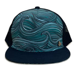 Front view of the Waves Trucker Hat with ocean wave print, breathable mesh back, and adjustable snap closure.