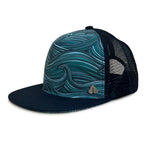 Side profile of the Waves Trucker Hat featuring eco-friendly materials, mesh back, and flat brim.