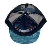 Underside view of the Waves Trucker Hat, showing its durable construction, soft interior, and flat brim.