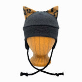 Gray beanie with cat ears on a wooden mannequin head against a white background