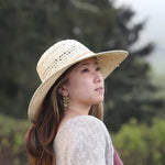 Yoko Sun Hat side view on female model – feather-light SPF straw hat for summer wear