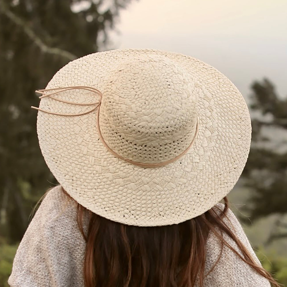 Yoko Sun Hat back top view on female model – feather-light SPF straw hat for summer wear