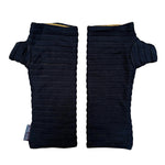 Pair of black wrist warmers with pin tucks on a white background