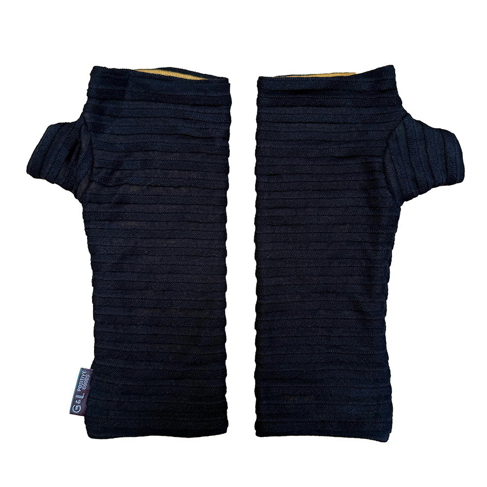 Pair of black wrist warmers with pin tucks on a white background