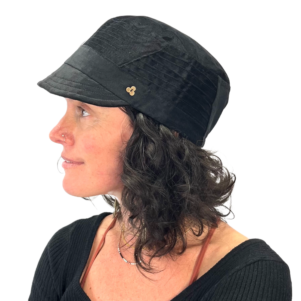 Art Soft Cap in black velvet on female model, profile view – eco-friendly cotton cap for women