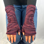 Bizou Wrist Warmers in raspberry color way on female model – stylish sustainable gloves