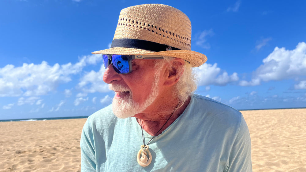 Male model styling the Charlie Fedora, showcasing eco-friendly fedora with black band and coconut button.