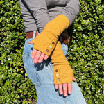 Coco Wrist Warmers in yellow dijon color on female model front view– bohemian sustainable gloves