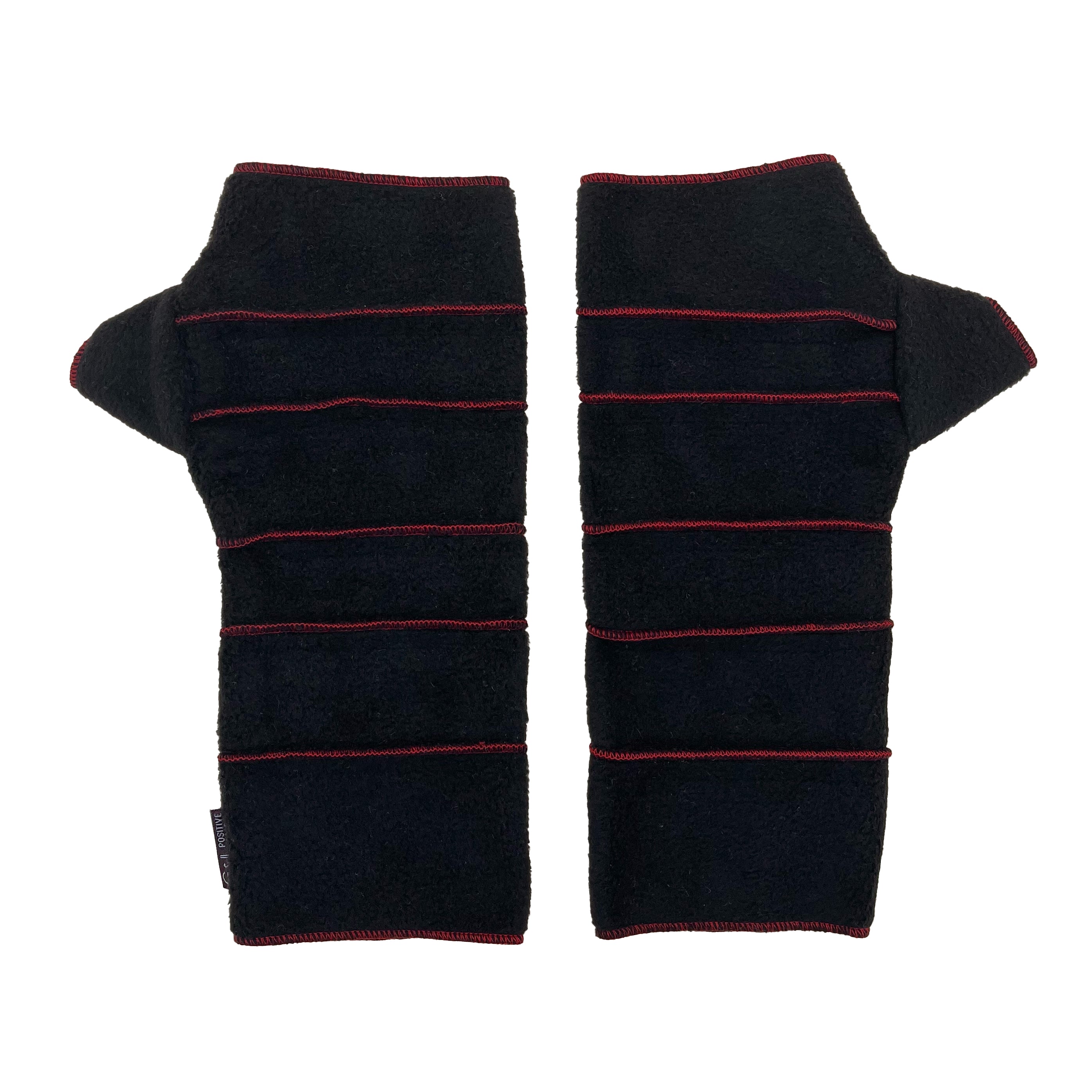Crossroads Polar Fleece Wrist Warmers – Front View – Upcycled & Sustainable. Black fingerless gloves with red stitching
 on a white background