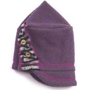 Dalhia Kids Soft Cap in plum color, profile angle on wooden head block – soft and adjustable kids cap