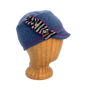 Dalia Kids Soft Cap in blue jean ocean color, profile angle on wooden head block – soft and adjustable kids cap