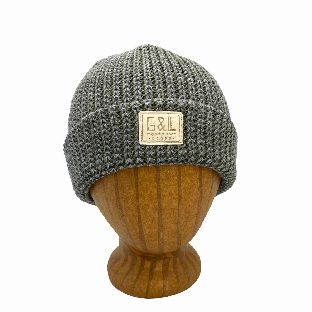 Denali Beanie front view in Chive color – worn on wooden head block.