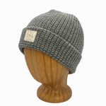 Denali Beanie side view in Chive color – worn on wooden head block.