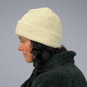 Denali Beanie creme salt on female model – cozy sustainable winter accessory
