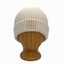 Denali Beanie front view in Linen color – worn on wooden head block.