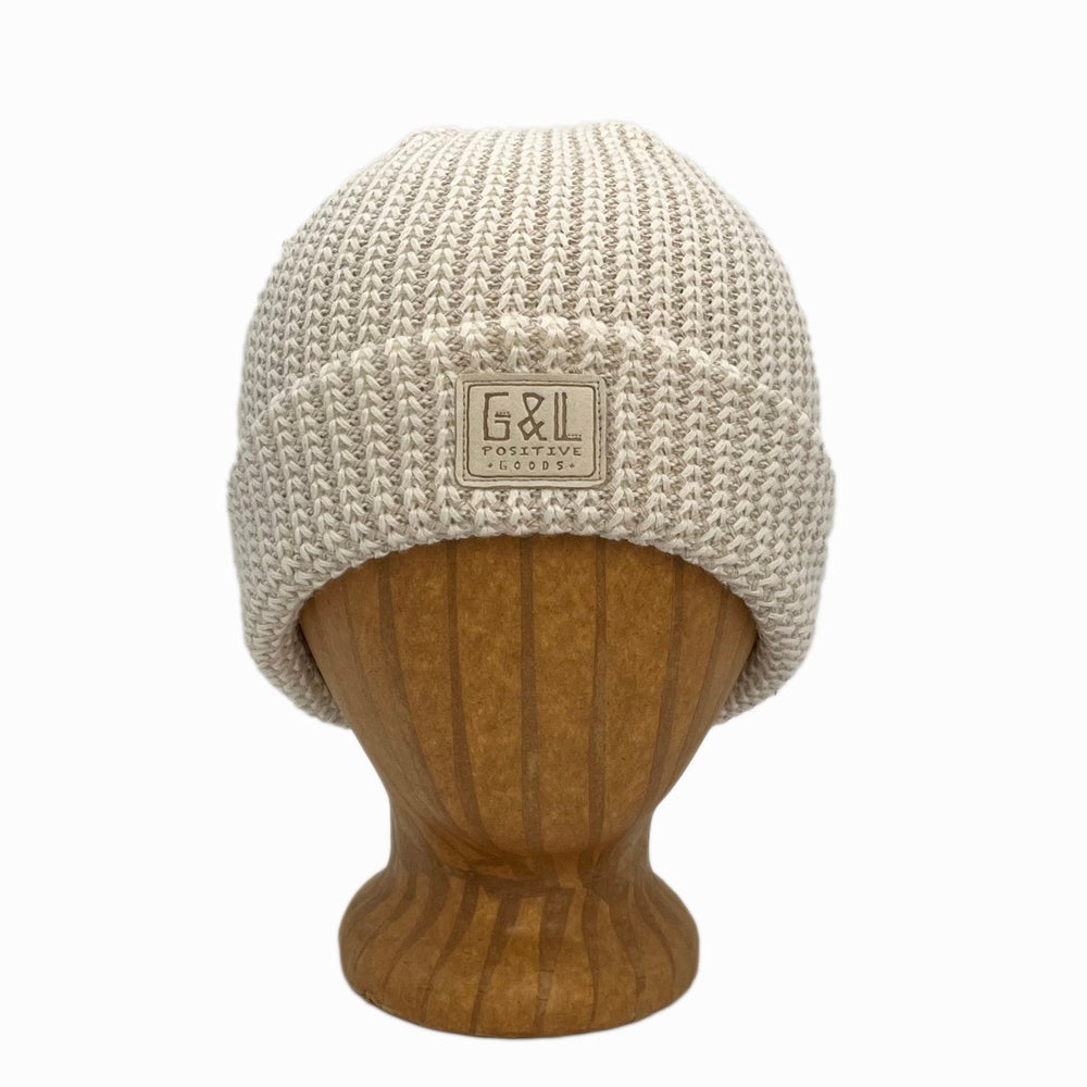Denali Beanie front view in Linen color – worn on wooden head block.