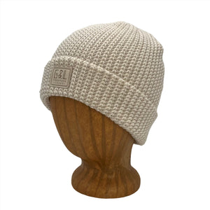 Denali Beanie side view in Linen color – worn on wooden head block.
