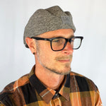 Male model styling the Dublin Flat Cap with casual eco-fashion look.