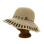 Side view of Beach Weave Frida Toyo Straw Sun Hat, hand-crocheted with wide brim and adjustable sweatband.